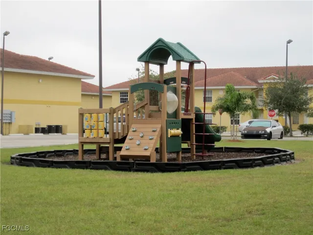 a table with chairs and a umbrella