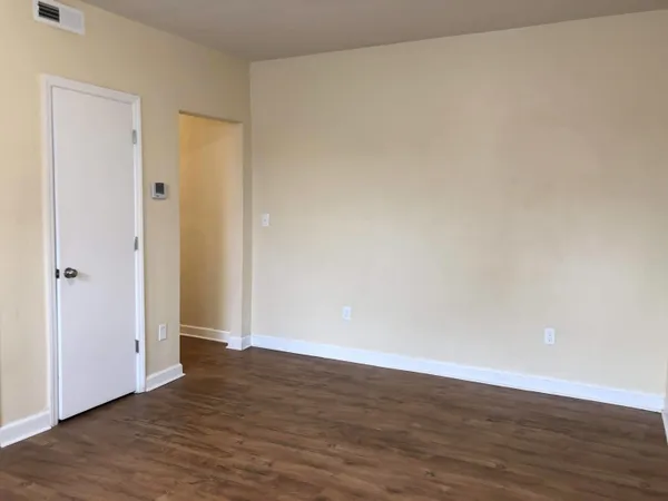 a view of front door with wooden floor