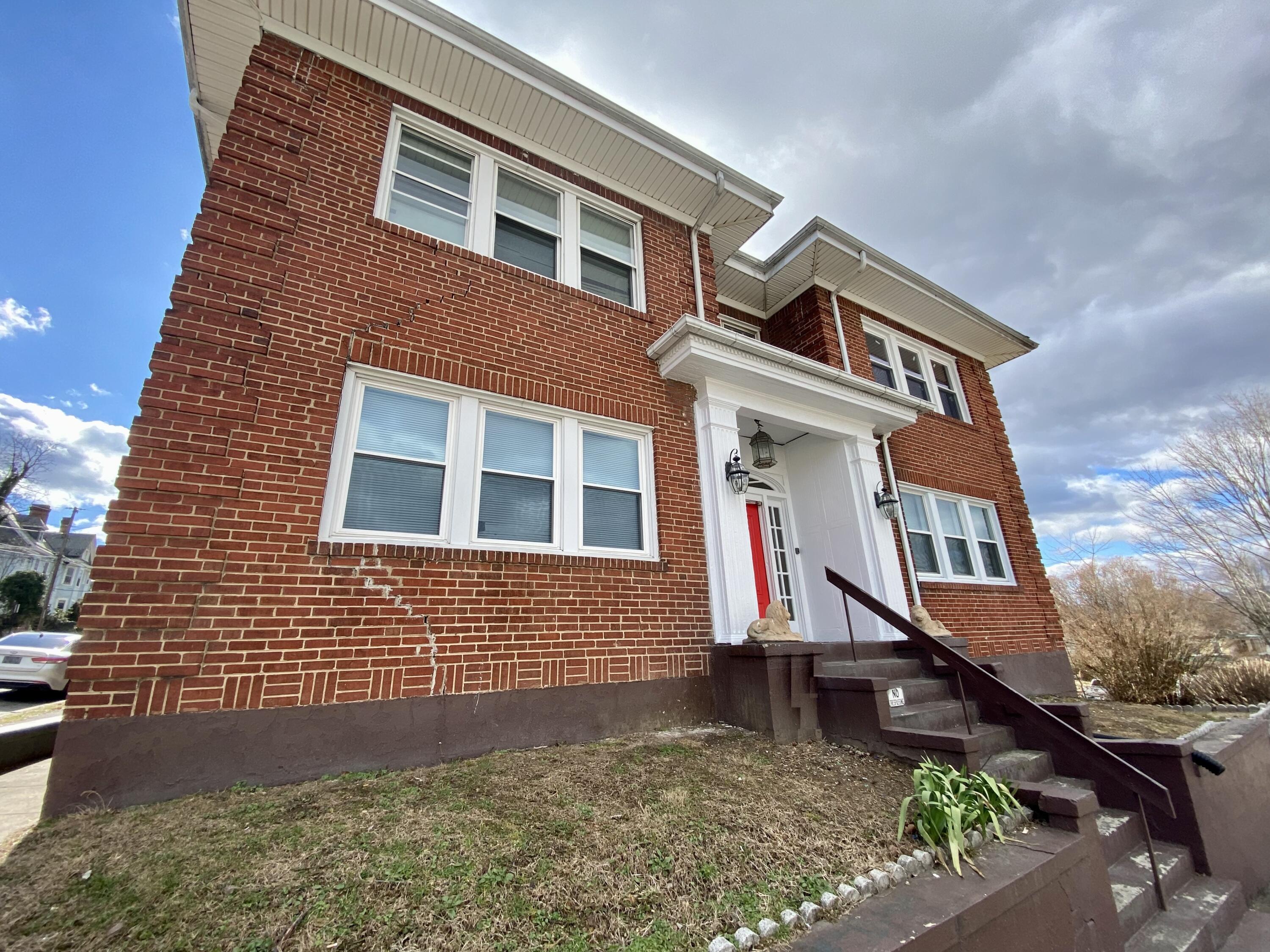 202 Elm Avenue, Unit A8 Roanoke, VA 24016 - Photo 2 of 23 a front view of a house with a yard