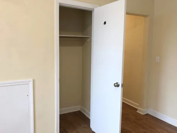 a white toilet sitting next to a shower