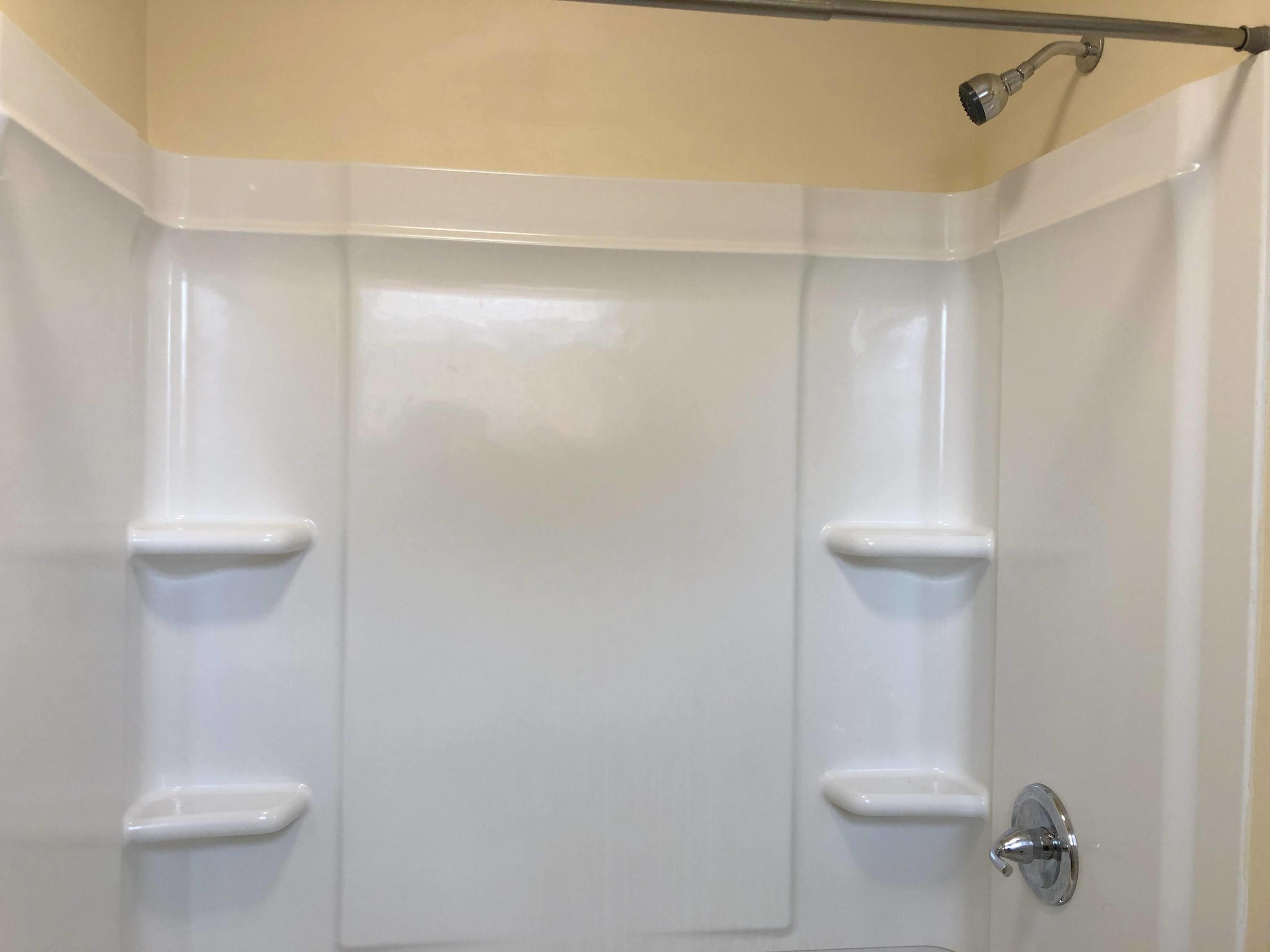 202 Elm Avenue, Unit A8 Roanoke, VA 24016 - Photo 23 of 23 a white toilet sitting next to a shower