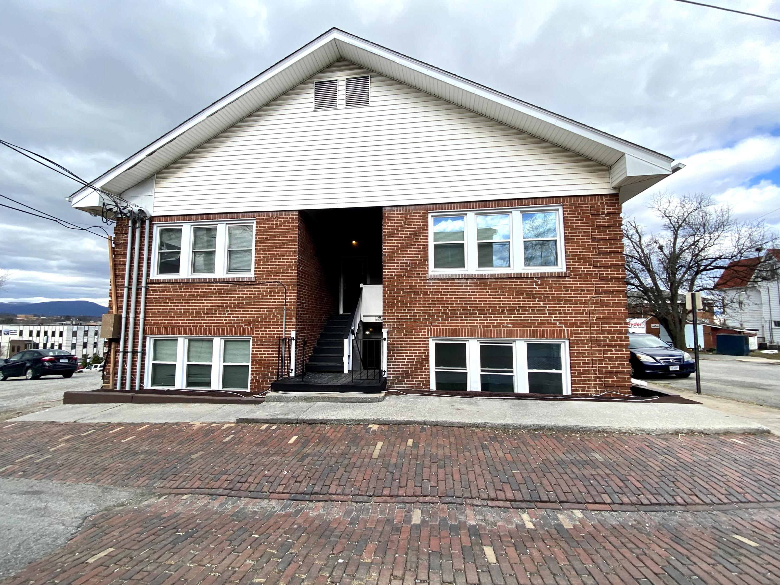 202 Elm Avenue, Unit A8 Roanoke, VA 24016 - Photo 5 of 23 a front view of a house with a road