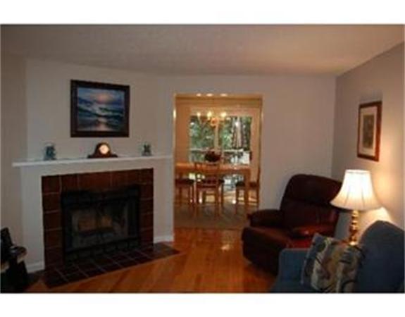 12 Shaw Farm Road, Unit 12 Canton, MA 02021 - Photo 5 of 8 a living room with furniture a lamp and a fireplace