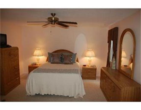 12 Shaw Farm Road, Unit 12 Canton, MA 02021 - Photo 8 of 8 a bedroom with a bed and a lamp