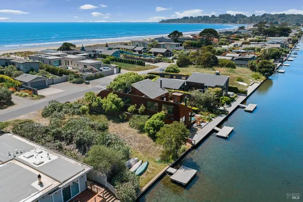 an aerial view of multiple houses with yard
