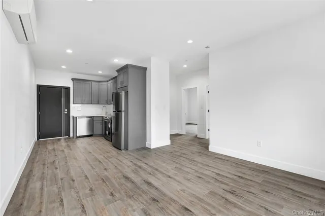 a view of a kitchen with wooden floor