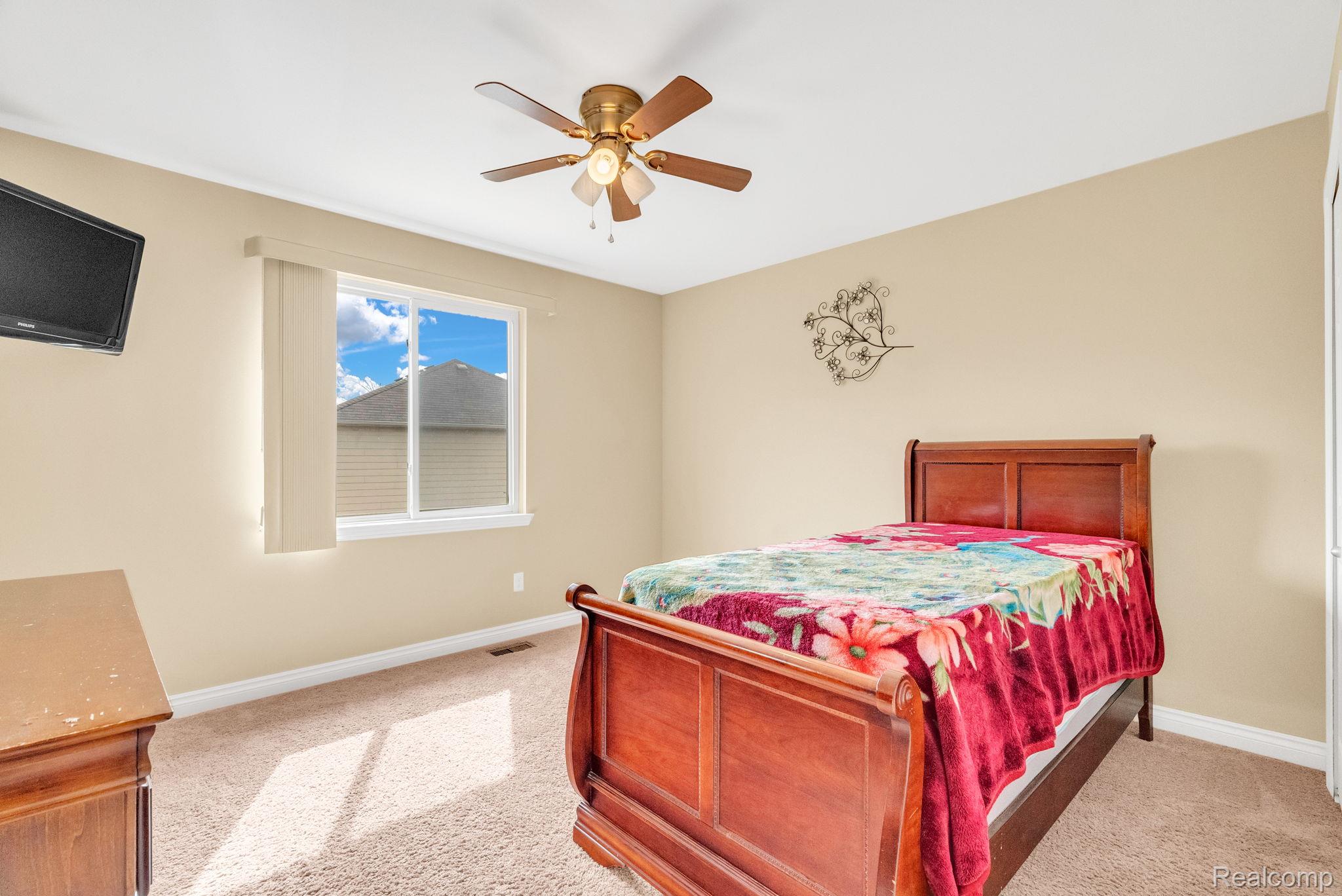 4122 Hawks Nest Road Utica, MI 48317 - Photo 46 of 74 Bedroom with light colored carpet and ceiling fan