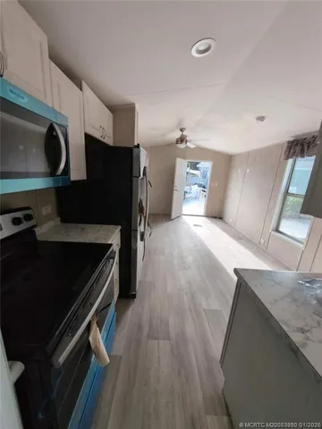 a kitchen with a stove and a microwave