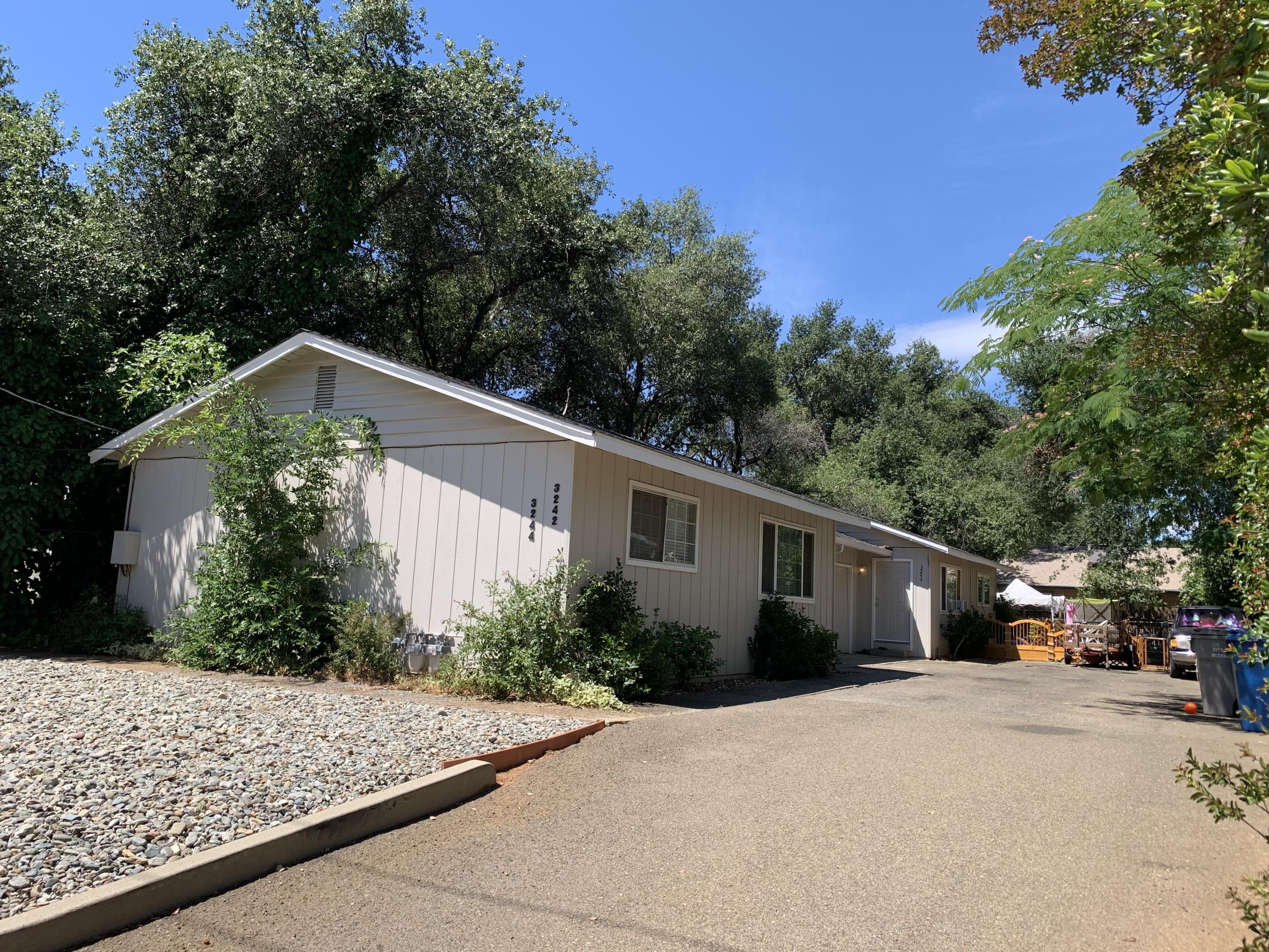 3242 Lawrence Road Redding, CA 96002 - Photo 1 of 17 a front view of a house with garden