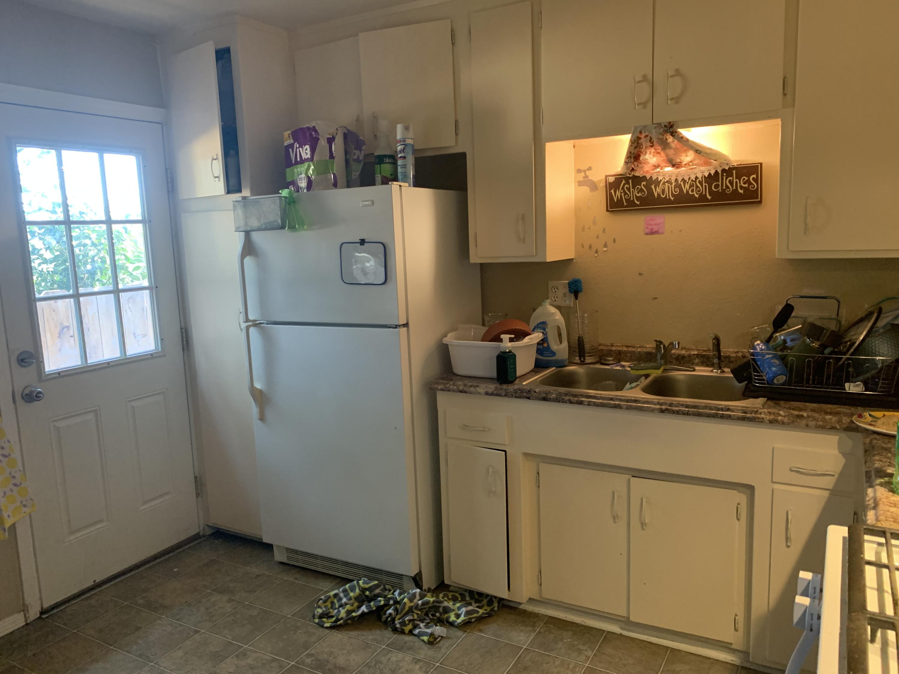3242 Lawrence Road Redding, CA 96002 - Photo 14 of 17 a kitchen with a refrigerator and window