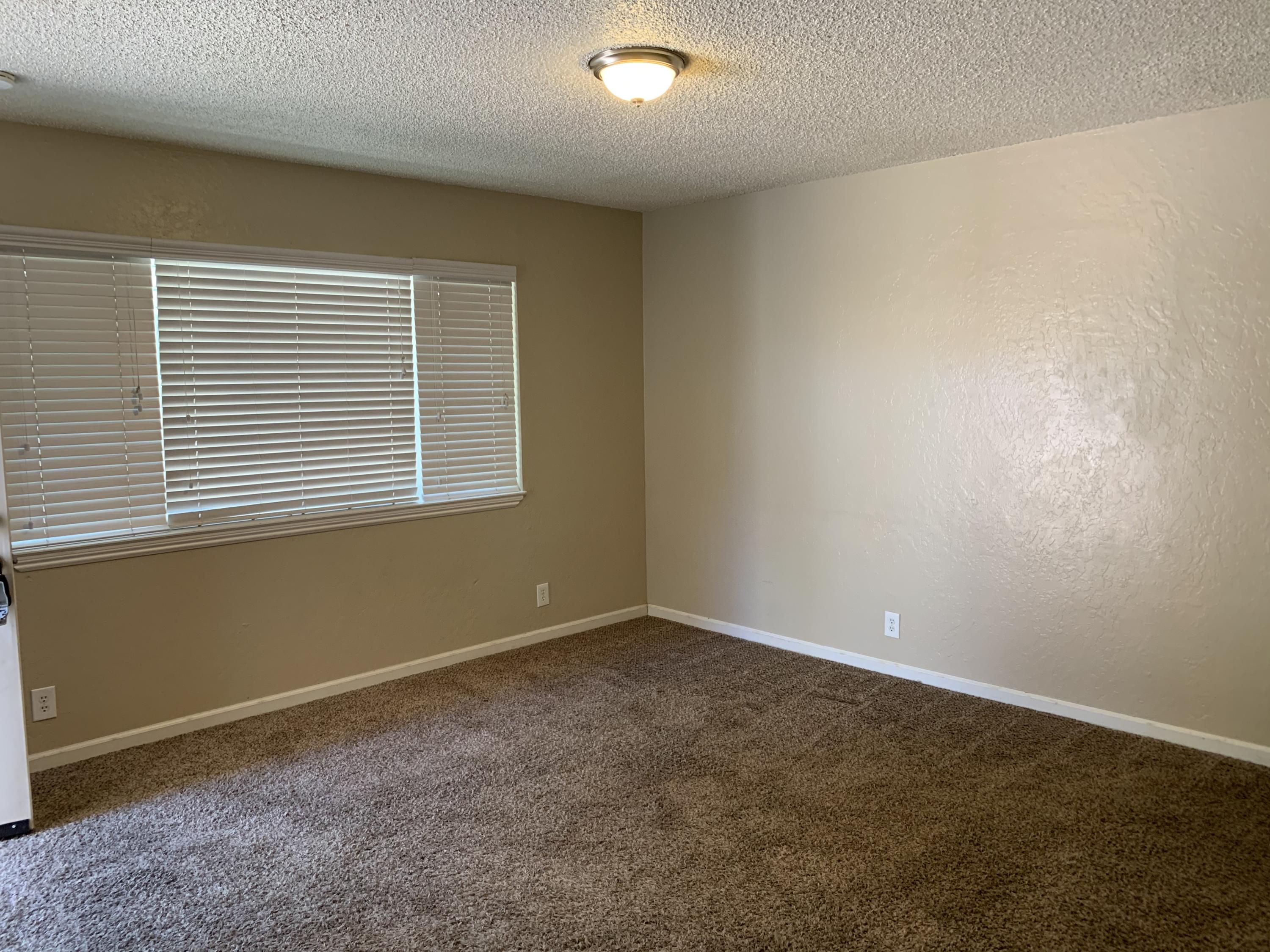 3242 Lawrence Road Redding, CA 96002 - Photo 6 of 17 an empty room with a window