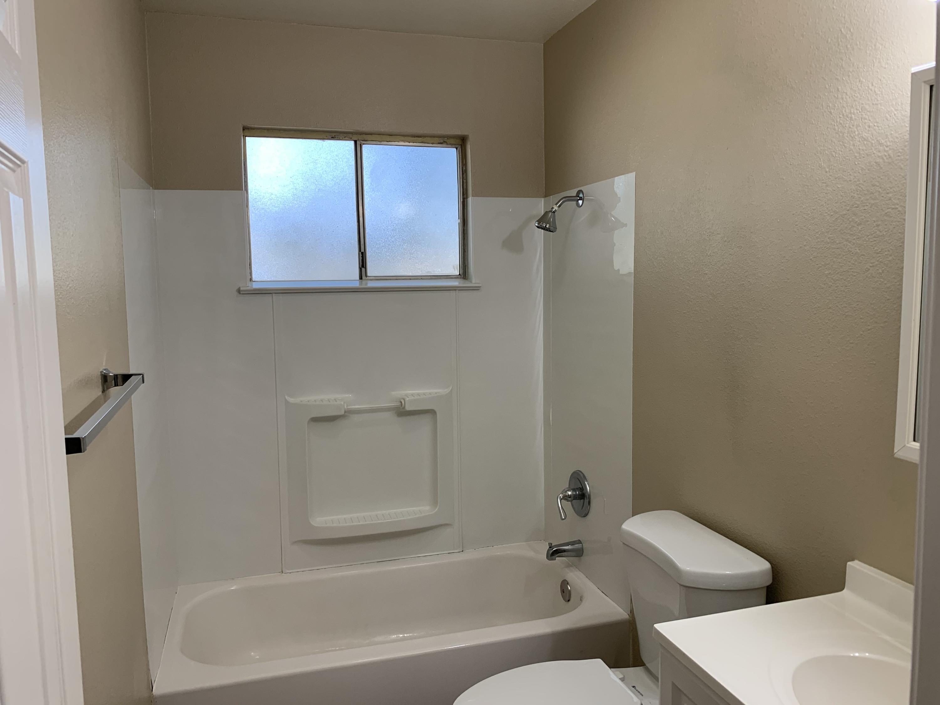 3242 Lawrence Road Redding, CA 96002 - Photo 7 of 17 a bathroom with a toilet and a bathtub