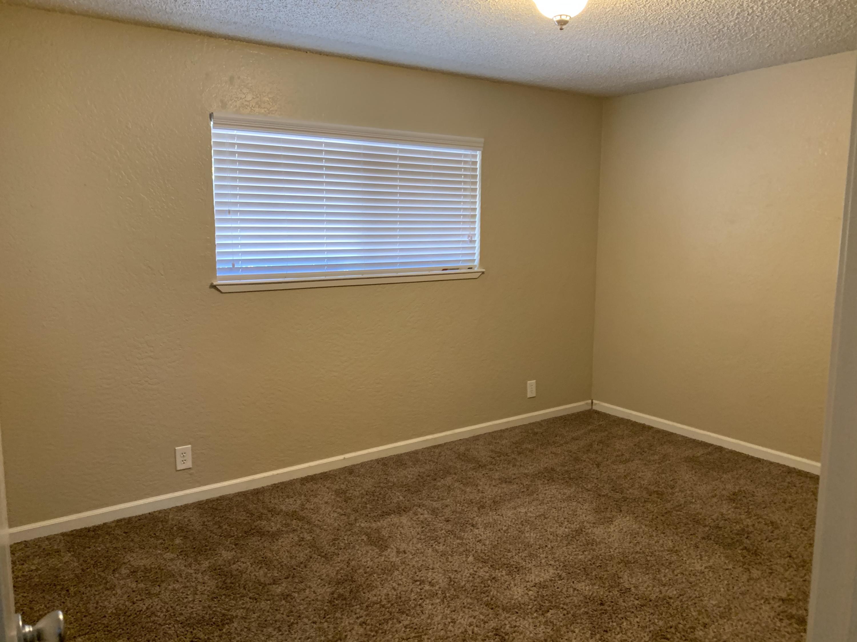 3242 Lawrence Road Redding, CA 96002 - Photo 8 of 17 an empty room with a window
