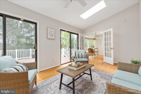 a view of a livingroom with furniture and a large window