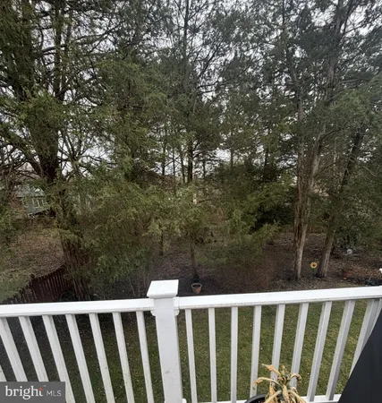 a front view of a house with a garden and plants