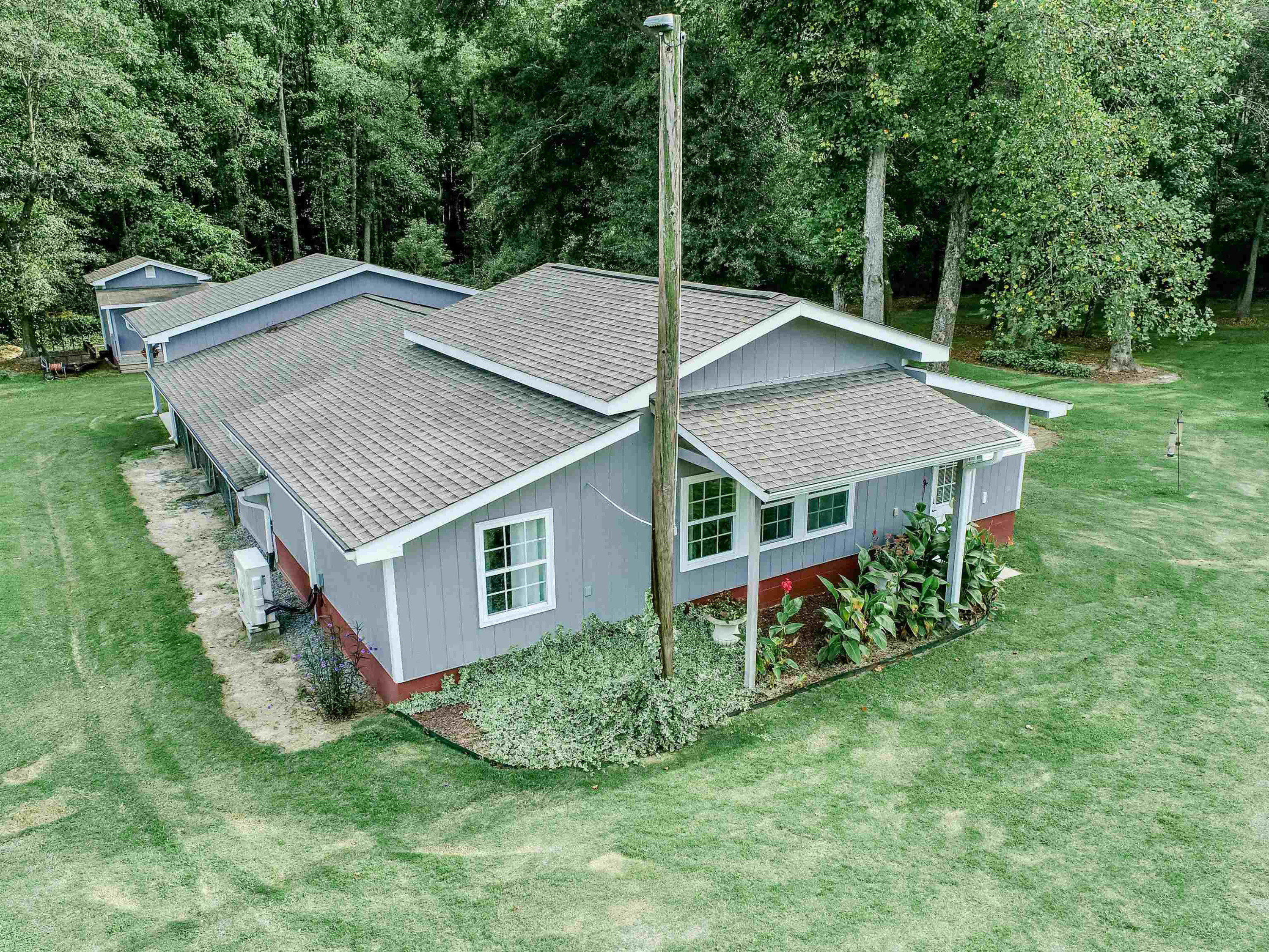 441 Zacks Mill Road Benson, NC 27504 - Photo 42 of 69 800 sqft heated and cooled. 640 sqft storage. Plus outside storage for equipment under sheltered. And a 25ft covered concrete pad. Detached Rec Building