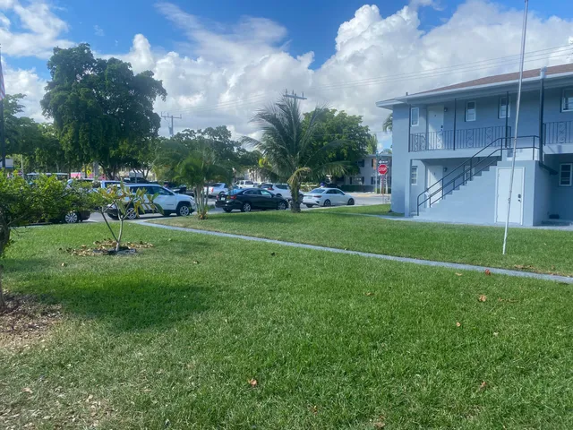 a view of a back yard of the house and green space