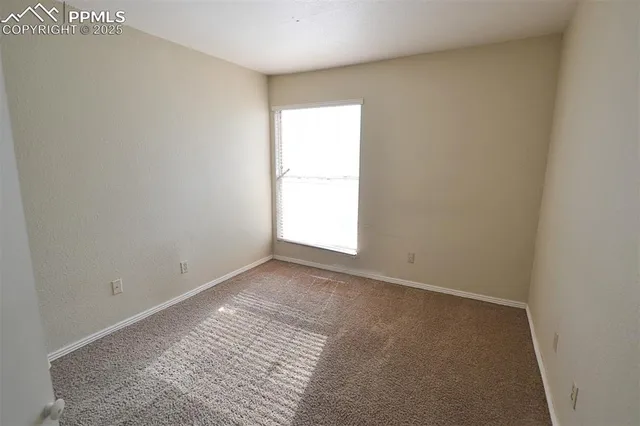 a bathroom with a granite countertop sink a toilet a mirror and a bathtub