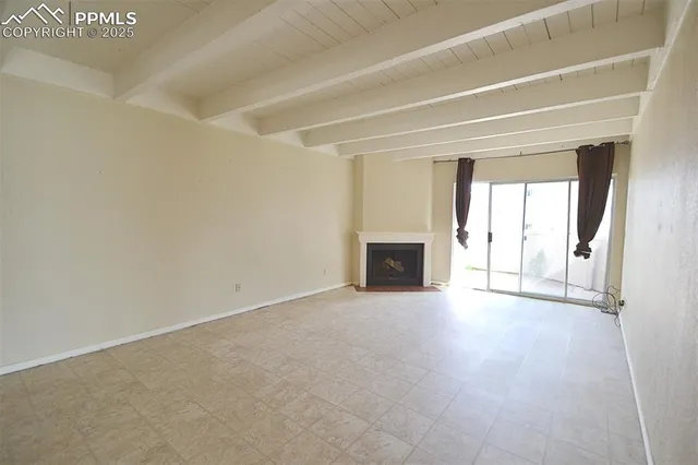 an empty room with fireplace