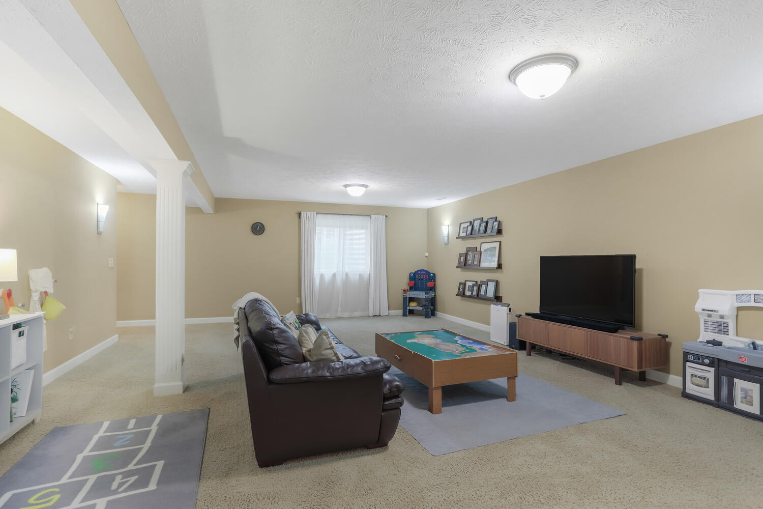 Undisclosed Address Savoy, IL 61874 - Photo 8 of 29 a living room with furniture and a flat screen tv