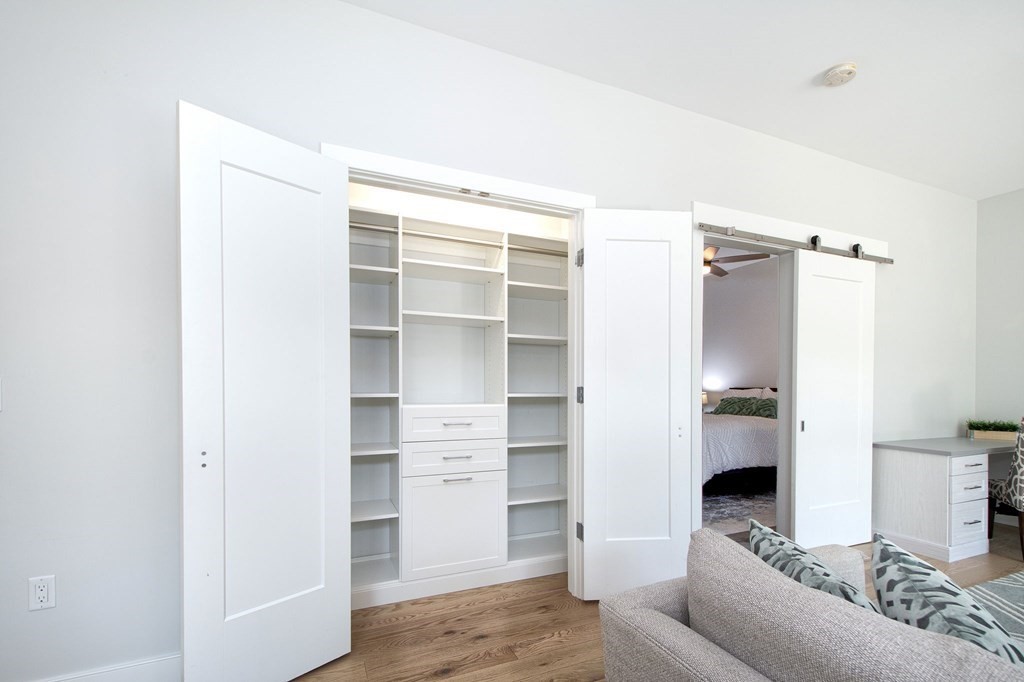 10 Shipyard Drive, Unit 102 Hingham, MA 02043 - Photo 11 of 31 a living room with furniture and a window
