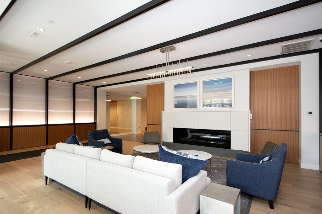 10 Shipyard Drive, Unit 102 Hingham, MA 02043 - Photo 24 of 31 a living room with furniture and a fireplace