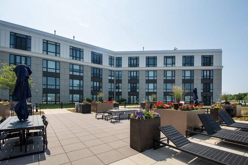 10 Shipyard Drive, Unit 102 Hingham, MA 02043 - Photo 28 of 31 a view of a building with sitting area and furniture