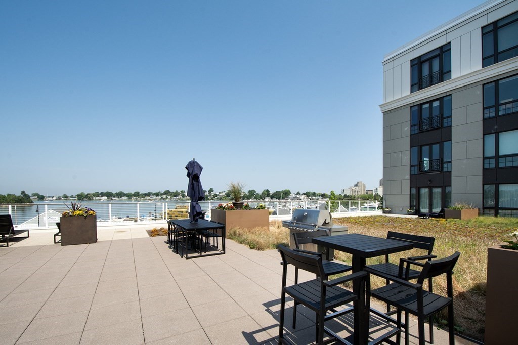 10 Shipyard Drive, Unit 102 Hingham, MA 02043 - Photo 29 of 31 a sitting area with furniture and city view