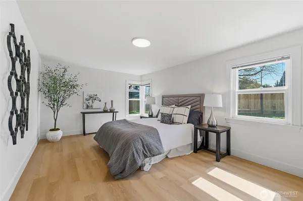 a bedroom with a large bed and a window