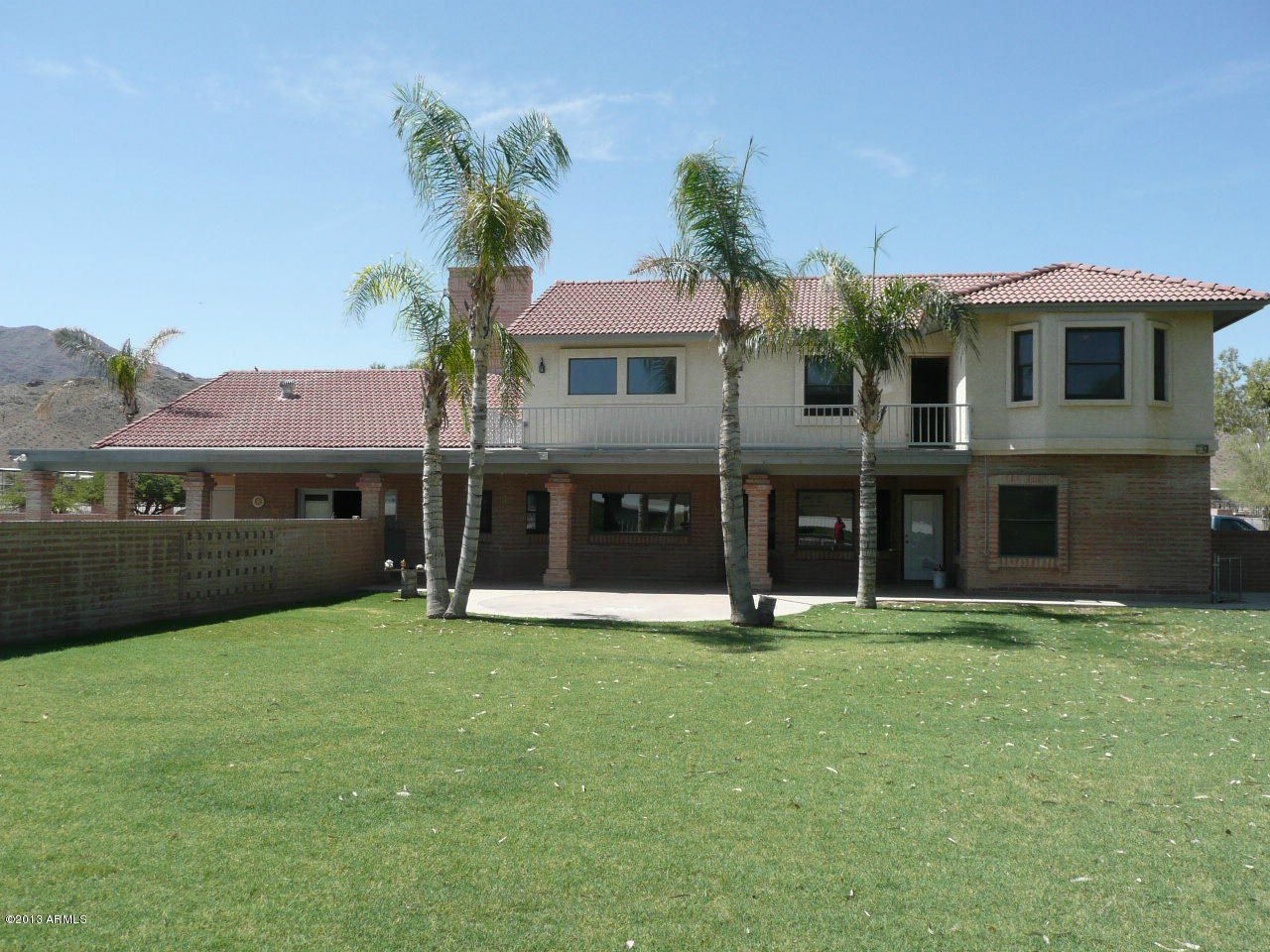 4128 West Elliot Road Laveen, AZ 85339 - Photo 12 of 114 a front view of a house with a yard