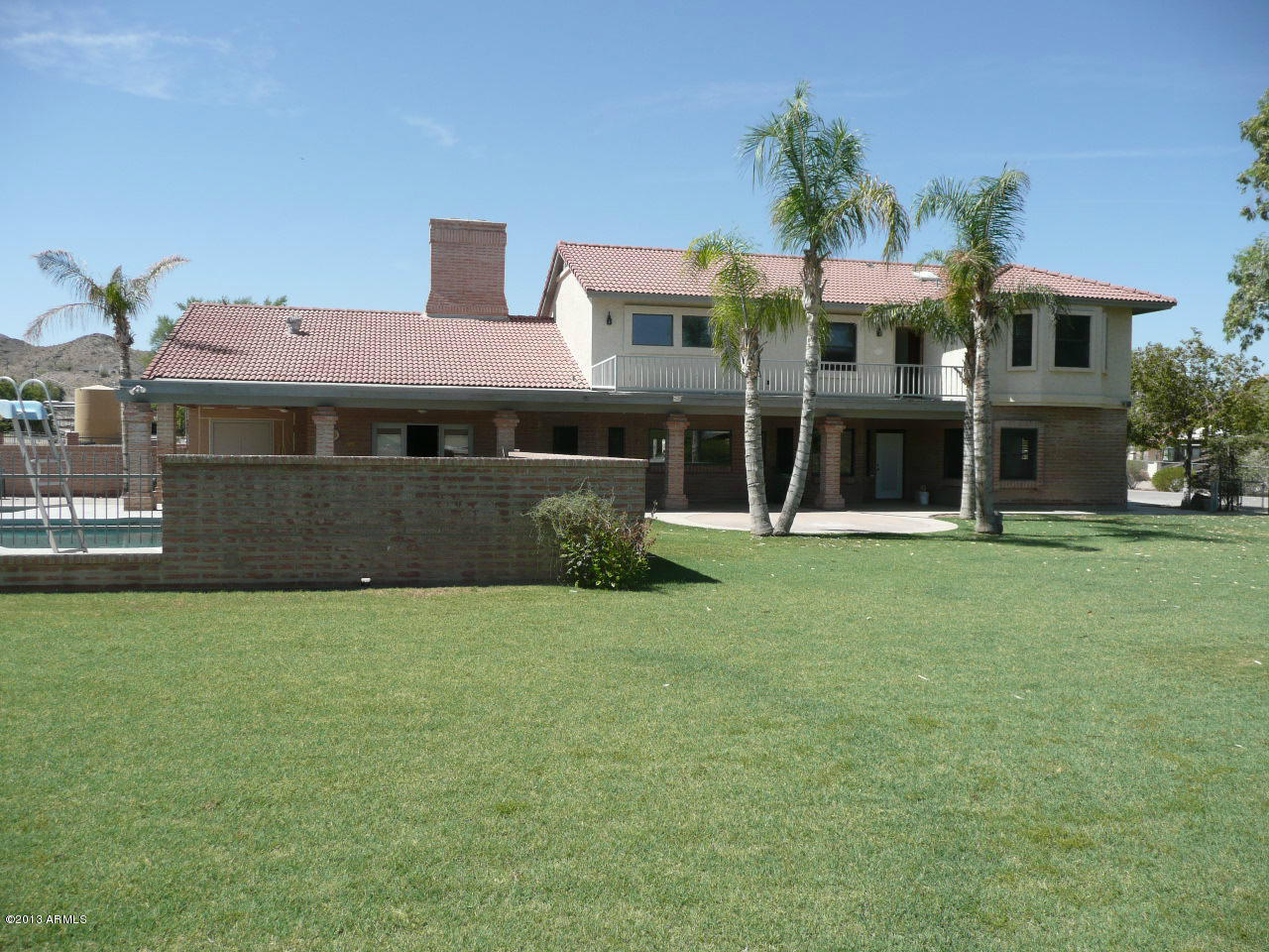4128 West Elliot Road Laveen, AZ 85339 - Photo 17 of 114 a front view of a house with a yard