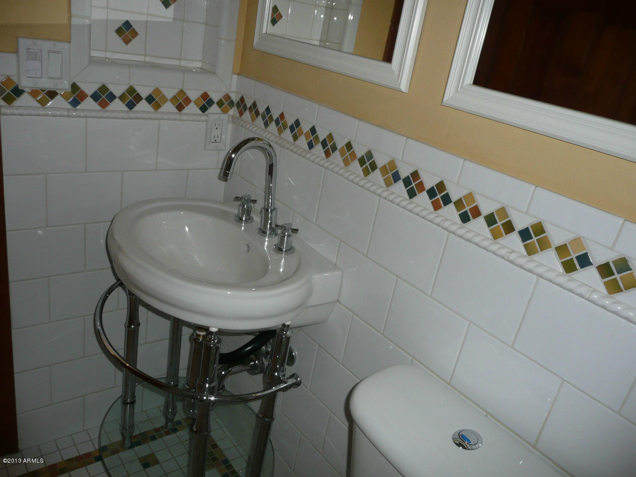 4128 West Elliot Road Laveen, AZ 85339 - Photo 38 of 114 a bathroom with a sink and mirror with toilet