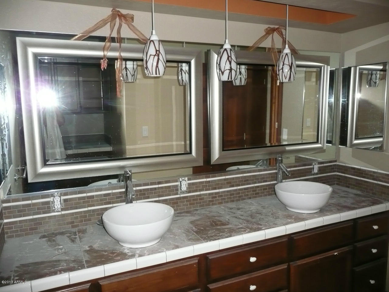 4128 West Elliot Road Laveen, AZ 85339 - Photo 41 of 114 a bathroom with a granite countertop sink and a mirror