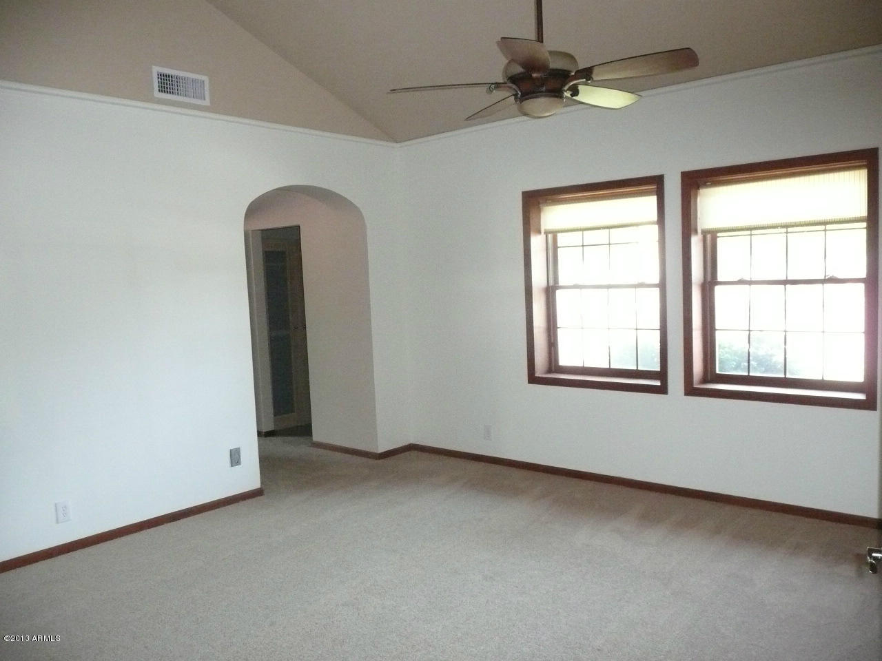 4128 West Elliot Road Laveen, AZ 85339 - Photo 56 of 114 an empty room with windows and fan