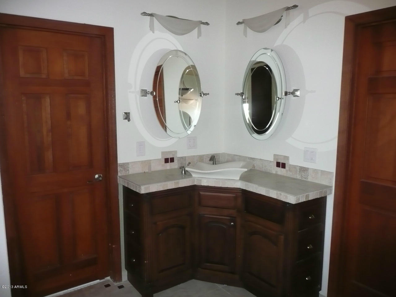 4128 West Elliot Road Laveen, AZ 85339 - Photo 62 of 114 a bathroom with a double vanity sink and a mirror