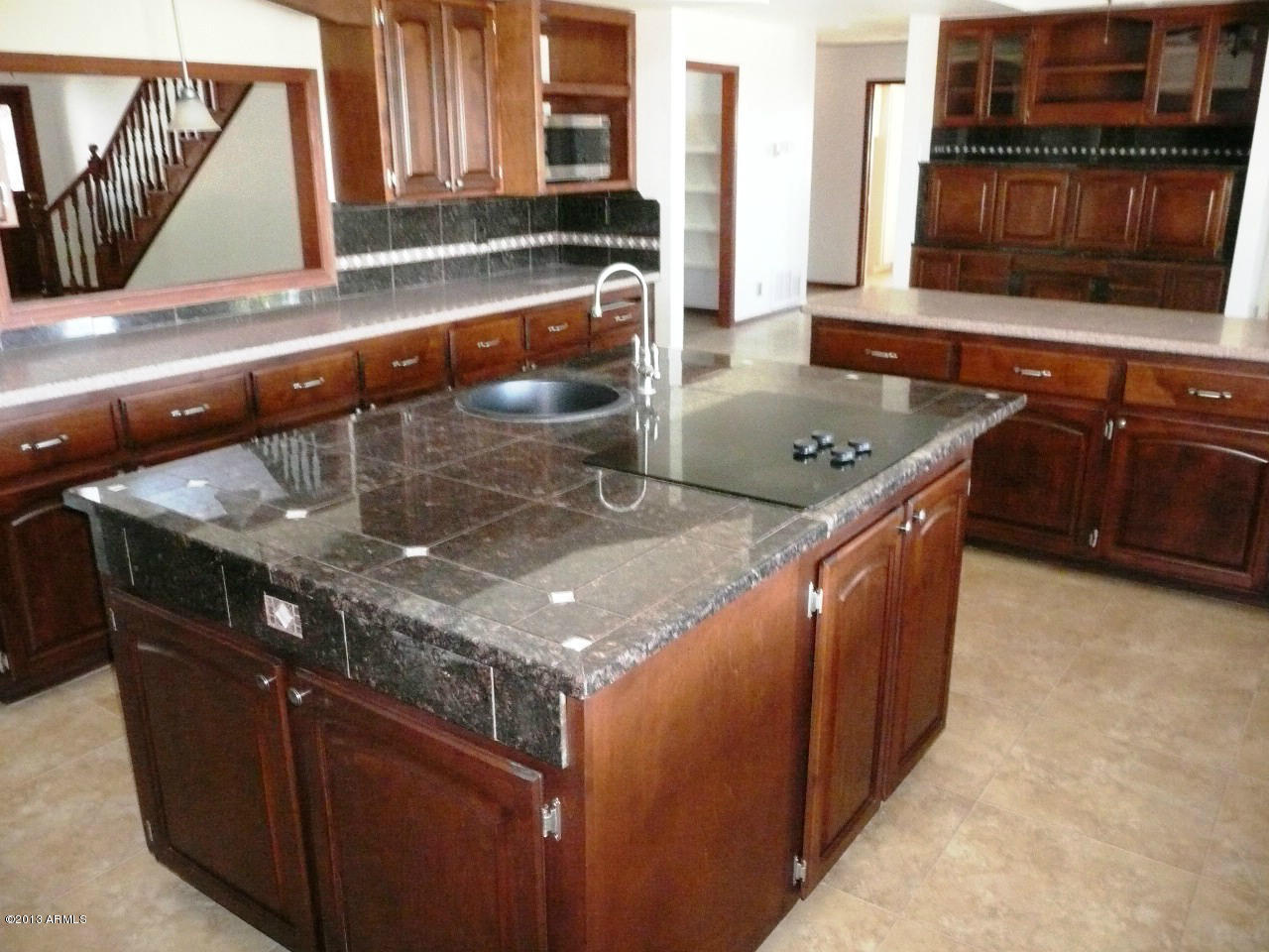 4128 West Elliot Road Laveen, AZ 85339 - Photo 67 of 114 a kitchen with stainless steel appliances granite countertop a sink and a stove