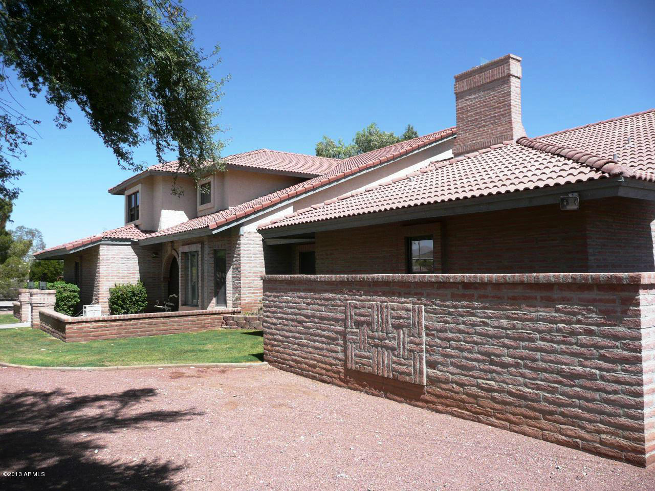 4128 West Elliot Road Laveen, AZ 85339 - Photo 7 of 114 a front view of a house with a yard