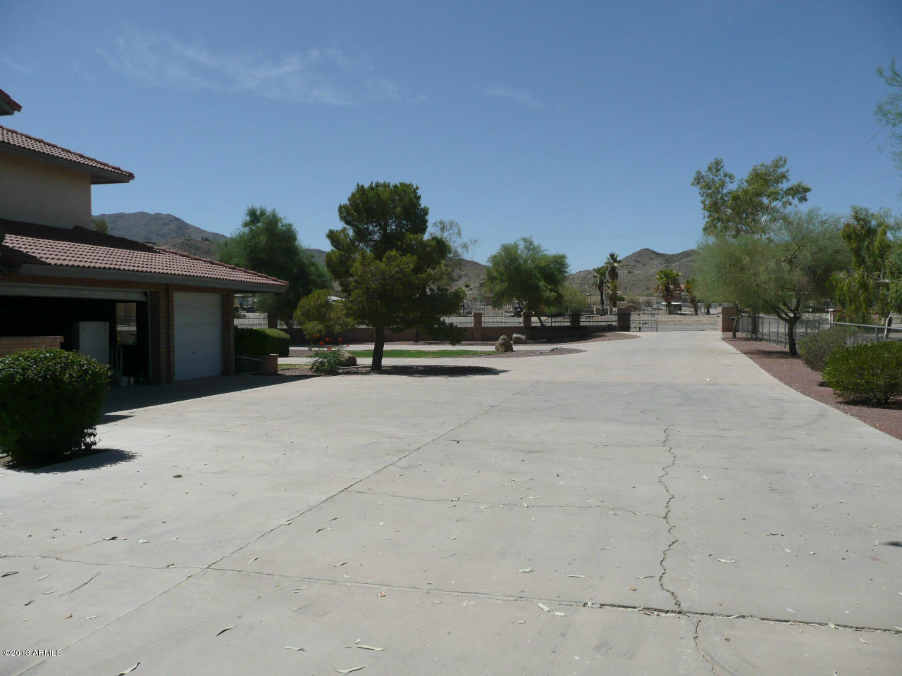 4128 West Elliot Road Laveen, AZ 85339 - Photo 9 of 114 Loooong driveway to exit gate