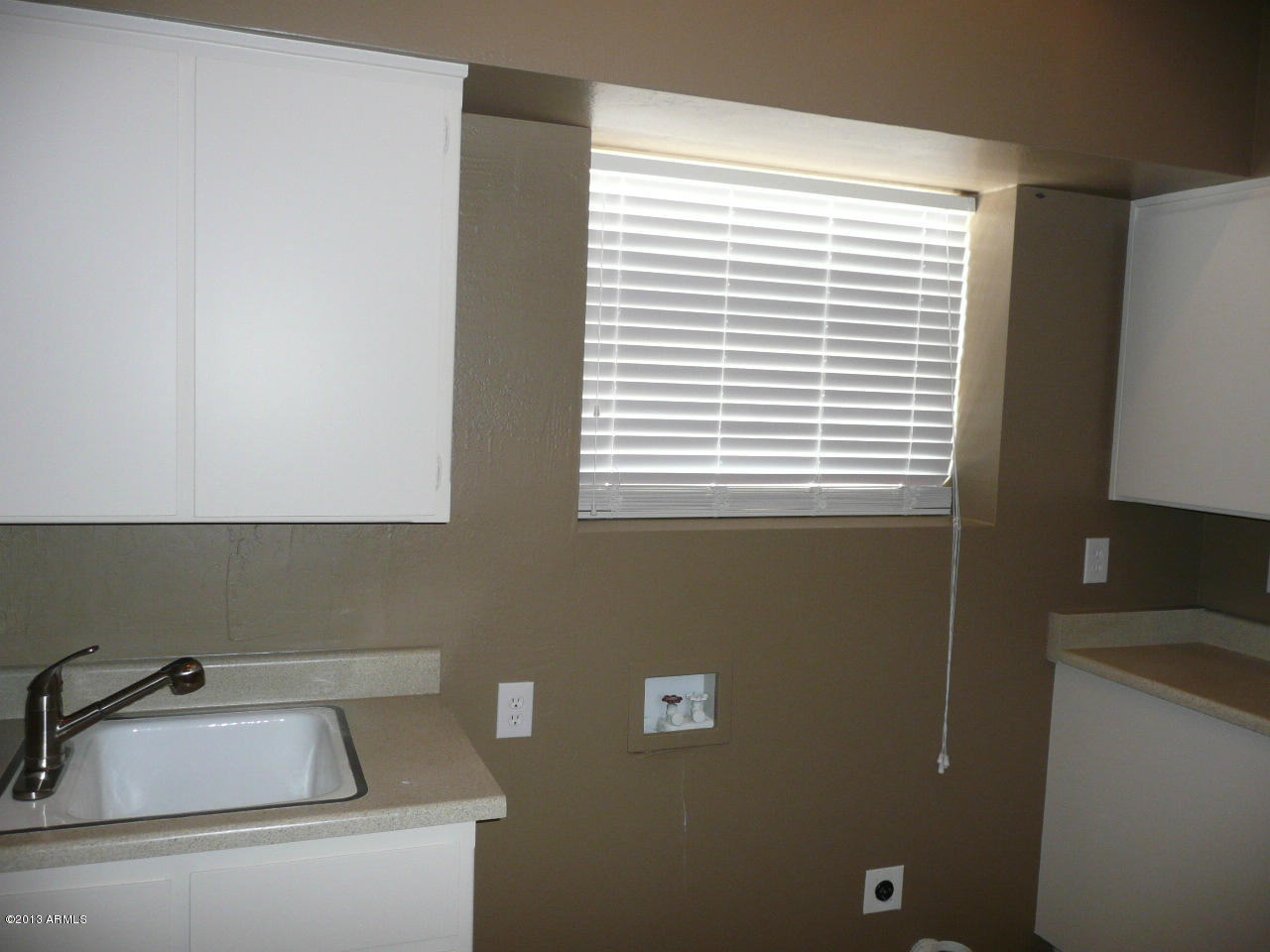 4128 West Elliot Road Laveen, AZ 85339 - Photo 97 of 114 a bathroom with a sink and a window