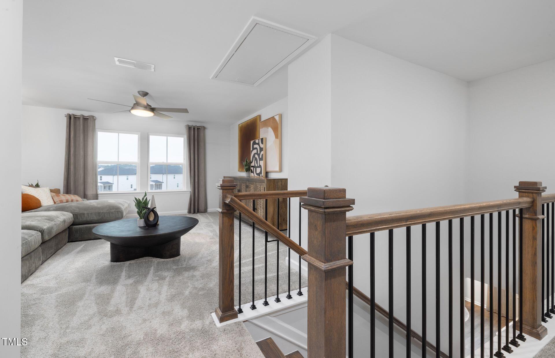 457 Grange Farm Place Raleigh, NC 27603 - Photo 12 of 30 a living room with furniture and a large window