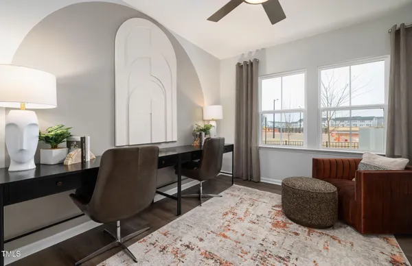 a workspace with furniture and a window