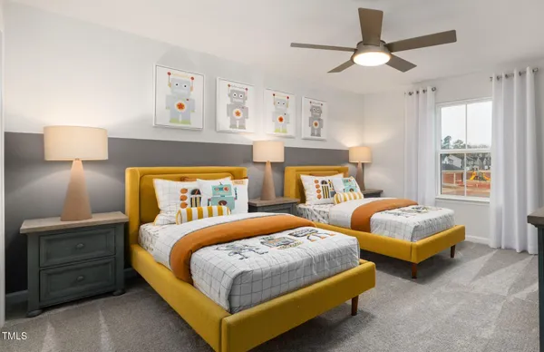 a bedroom with two beds and painting on the wall