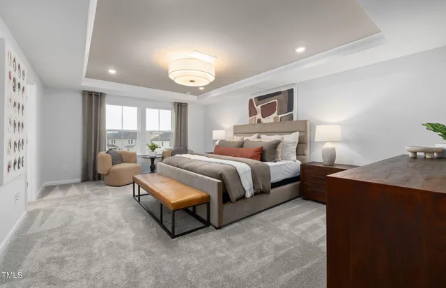 a bedroom with bed and a large window