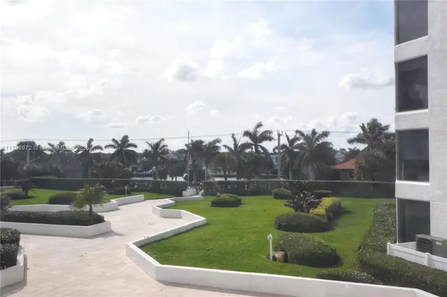 a bathroom with a toilet sink and shower