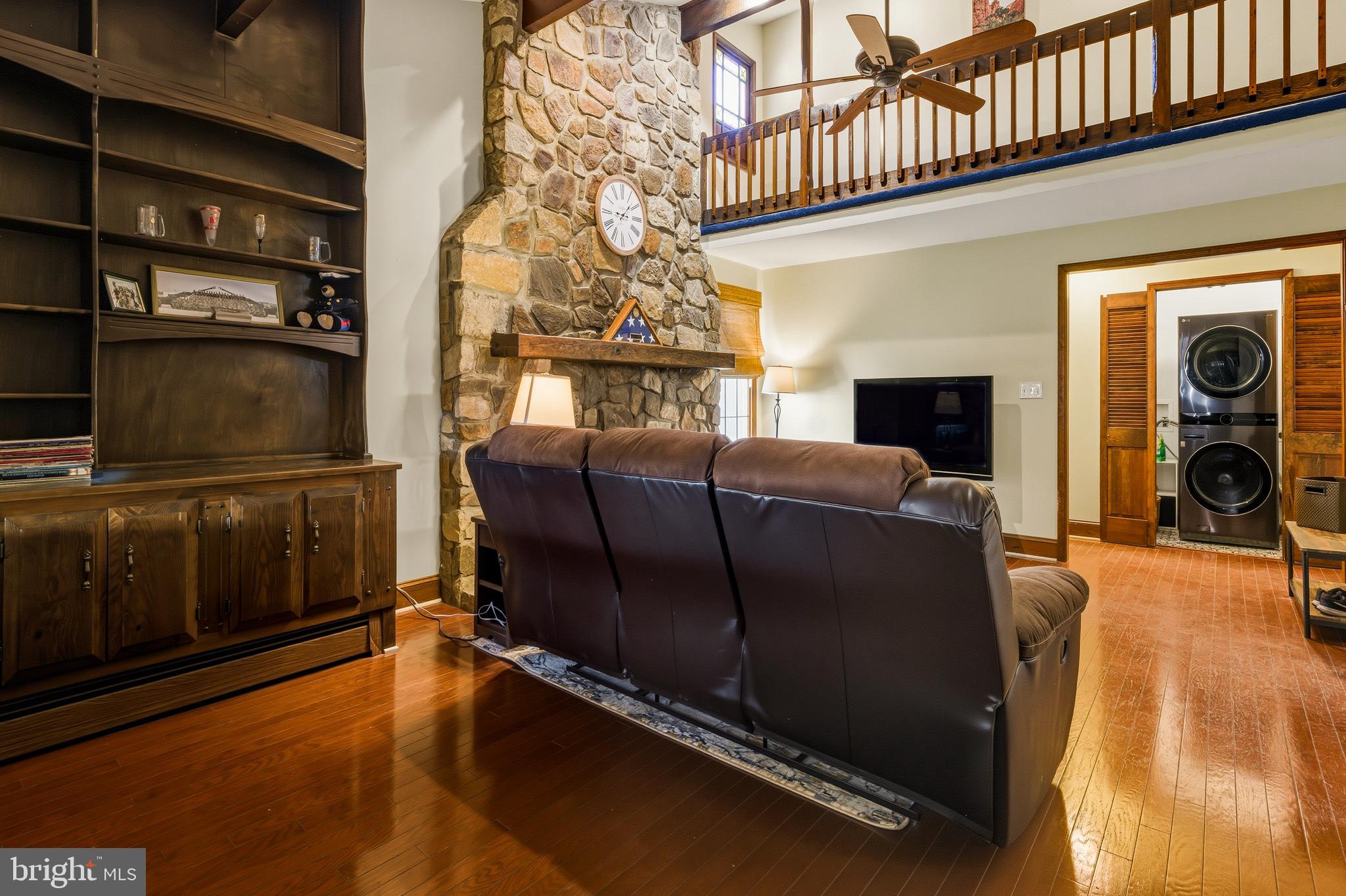 335 2nd Avenue Lindenwold, NJ 08021 - Photo 14 of 32 a living room with furniture fireplace and flat screen tv