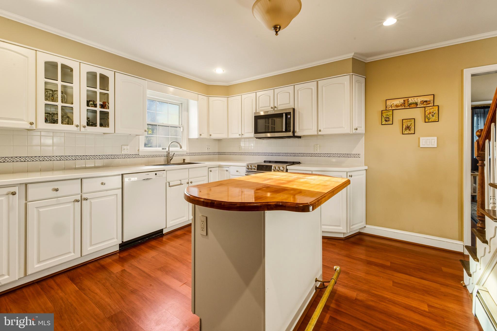 335 2nd Avenue Lindenwold, NJ 08021 - Photo 17 of 32 a kitchen with stainless steel appliances granite countertop a sink a microwave cabinets and wooden floor
