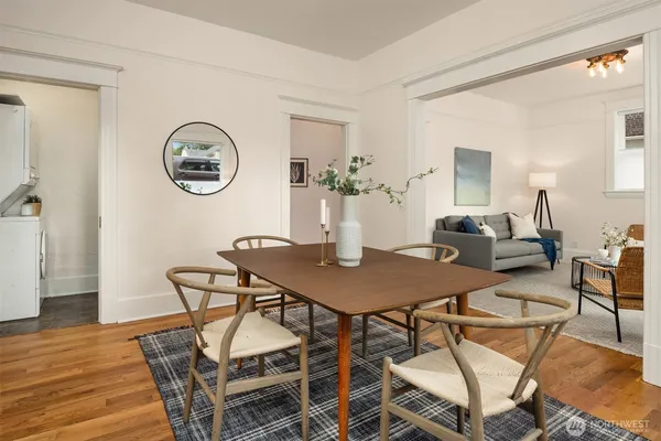 a view of a dining room with furniture and wooden floor