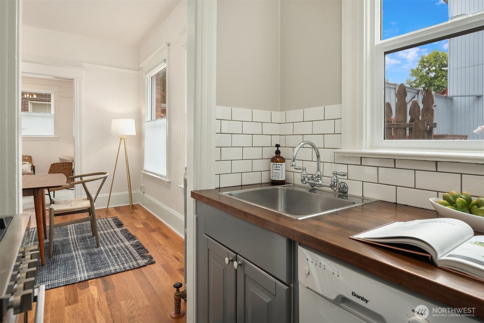 1726 15th Avenue, Unit 7 Seattle, WA 98122 - Photo 11 of 24 a kitchen with a sink and a refrigerator