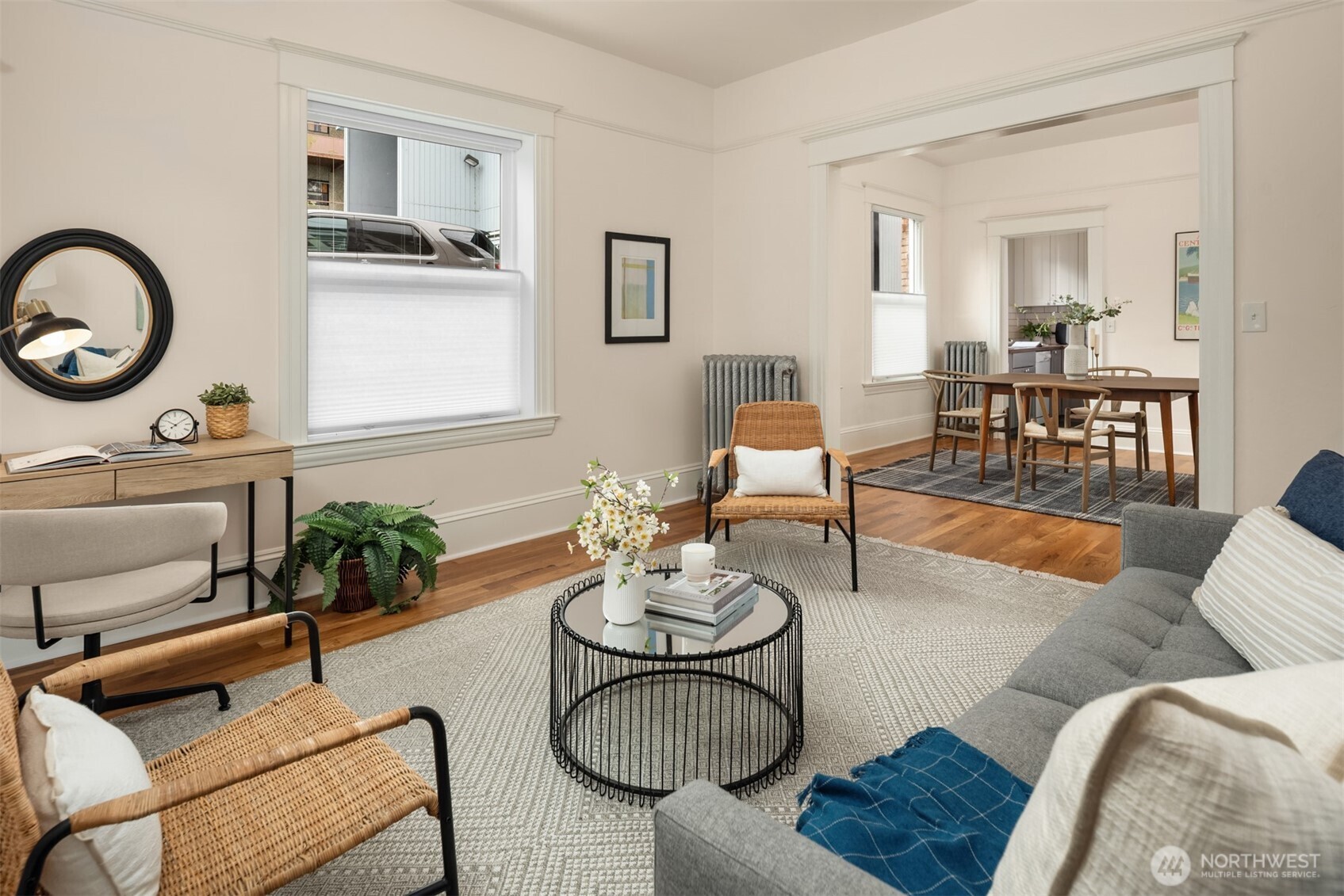 1726 15th Avenue, Unit 7 Seattle, WA 98122 - Photo 7 of 24 a living room with furniture potted plant and kitchen view