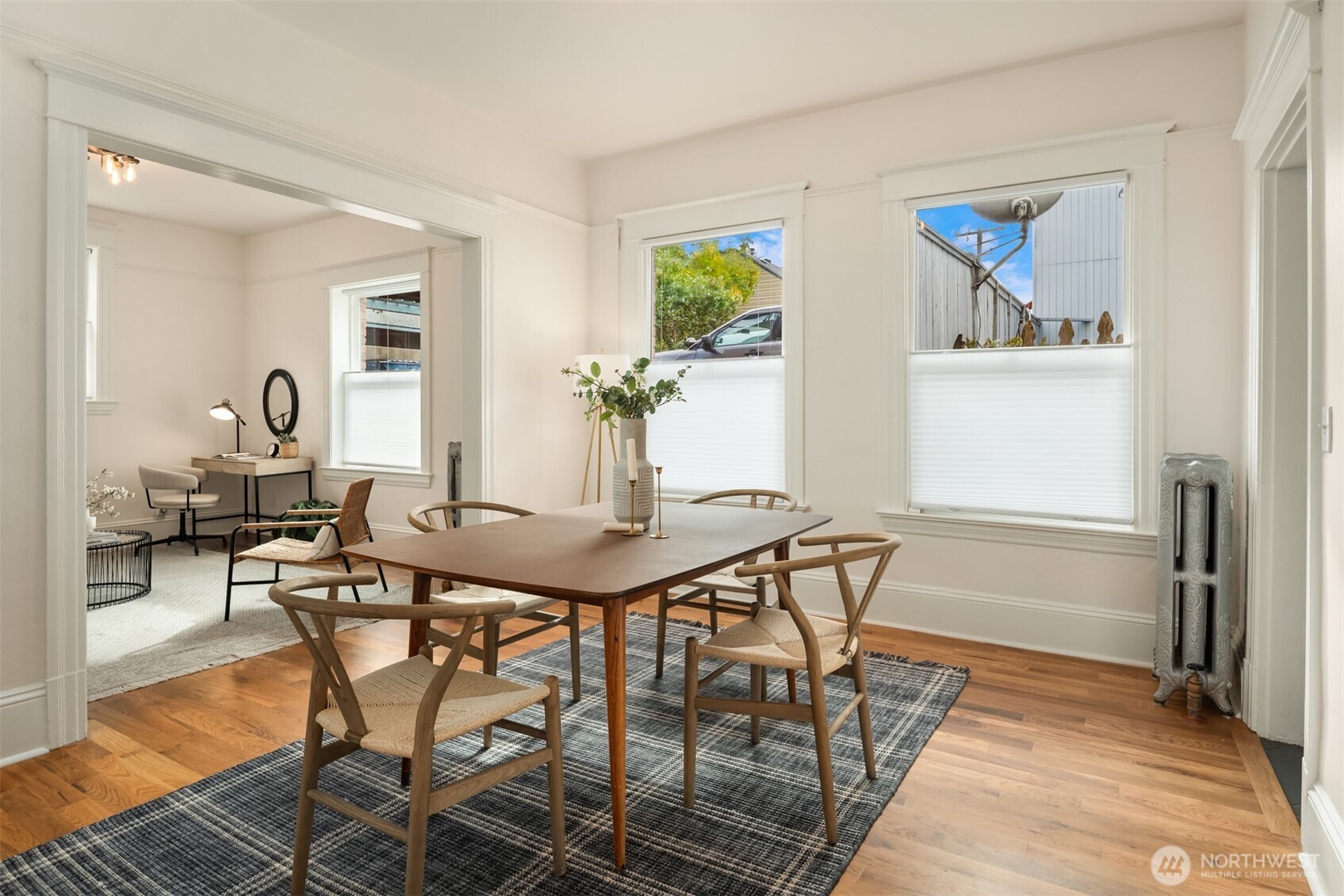 1726 15th Avenue, Unit 7 Seattle, WA 98122 - Photo 9 of 24 a view of a dining room with furniture and a rug